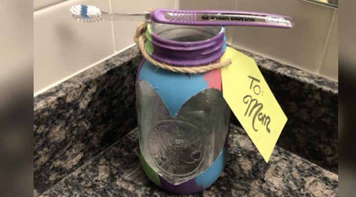 Looking for a Mother’s Day activity to make with the kiddos? This beautiful “stained-glass” toothbrush holder is a fond memory you can cherish and use!